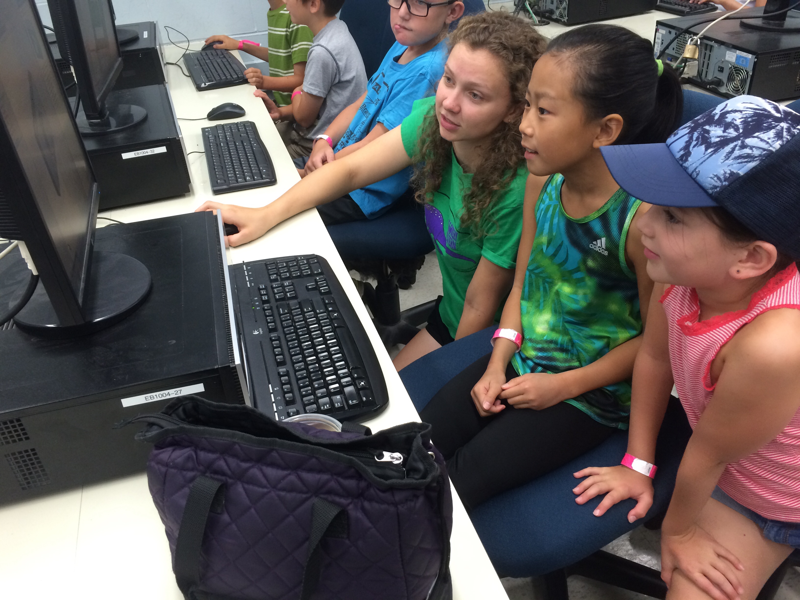 Image of summer camp participants coding